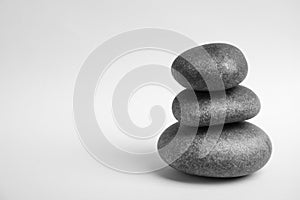 Stacked zen stones on white. Space for text