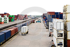 Stacker hold a container box and train freight cargo container.