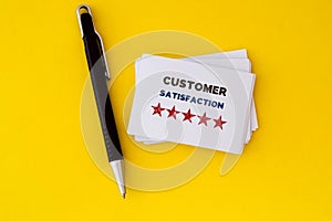Stacking of feedback with five star drawn on white business card , a excellent customer satisfaction feedback concept