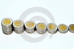 Stacks of 1 LE EGP one Egyptian pound coins cash isolated on white background, Egypt currency exchange rate concept with foreign