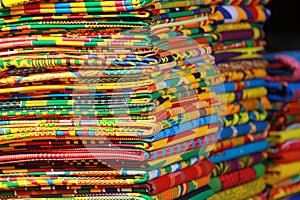 Stacks of African kente cloth on the streets of Accra