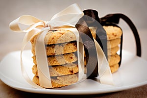 Stacks of apple chip cookies taped with silk ribbons