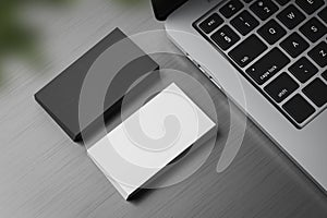 Stacks of black and white business cards on table