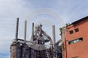 Stacks blast furnaces with rusting exterior, abandoned industrial landscape