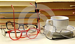 Stacks of books and eyeglasses. Reading, education, literature, library