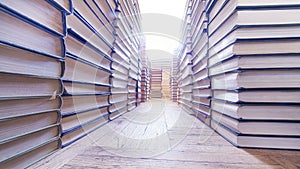 Stacks of books on the old parquet wide angle view