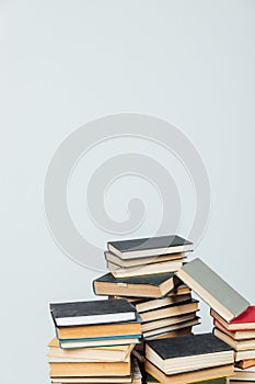 Stacks of books for teaching knowledge of the college school library white background