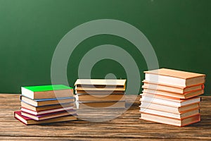 Stacks of books on wooden surface