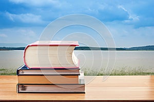 Stacks of books on wooden table, back to school