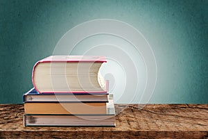 Stacks of books on wooden table, back to school concept