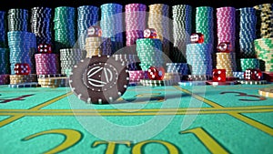 Stacks of casino chips and red dice on green gaming table casino against a black background. One chip rotates on the