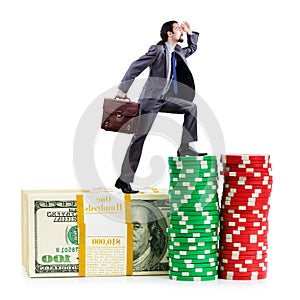 Stacks of chips and climbing businessman