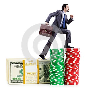 Stacks of chips and climbing businessman