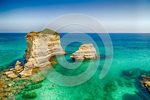 Stacks on the coast of Apulia in Italy photo