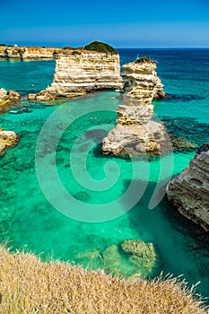 Stacks on the coast of Apulia in Italy photo