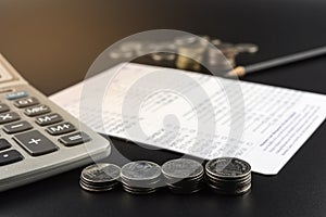 Stacks of Coin and and calculator on Banking Account for Business Finance Concept