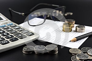 Stacks of Coin and and calculator on Banking Account for Business Finance Concept