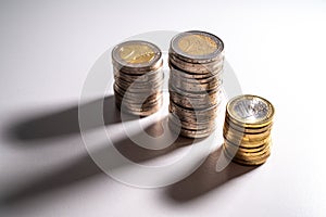 Stacks of coins close together.