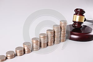 Stacks of coins and court gavel financial crimes
