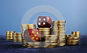Stacks of coins and dices. Trading and uncertainty in business. Financial risk.
