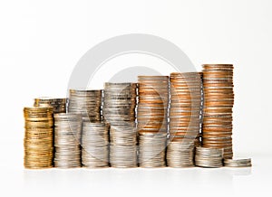 Stacks of coins on white background