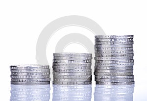 Stacks of coins on white background