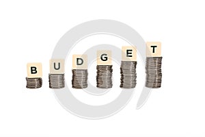 Stacks of coins on white background, budget chart.