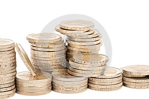 Stacks of coins on a white isolated background. 2 euro coins in a stack.