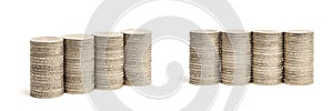 Stacks of coins on a white isolated background. 2 euro coins in a stack.