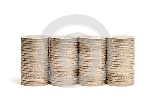 Stacks of coins on a white isolated background. 2 euro coins in a stack.