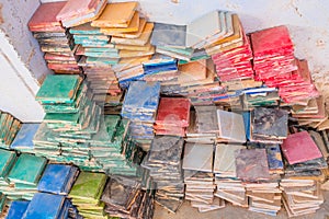 Stacks of colorful glazed square tiles for the use of zellige tilework. Fez, Morocco