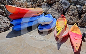 Stacks of colorful kayaks