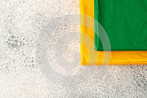 Stacks of colorful paper napkins on gray background