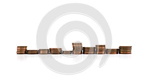 Stacks of copper coins in a row isolated on white