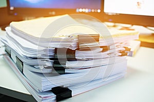 Stacks of documents files for finance of office working.Business report papers or Piles of unfinished document achieves with