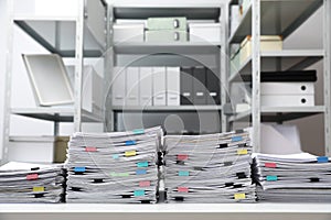 Stacks of documents with paper clips