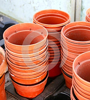 Stacks of empty plastic plant pots