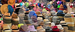 Stacks of fashionable hats in different styles and colors in the hat shop