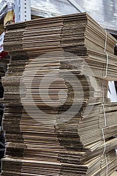 stacks of folded cardboard boxes in a warehouse or in a store