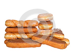 Stacks of glazed twist, chocolate frosted bars, sugar coated donuts, isolated