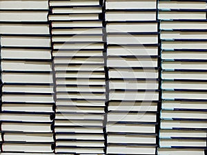 Stacks of hardcover books.