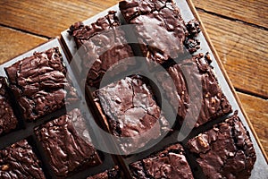 Stacks of homemade chocolate brownies sitting on a cafe table