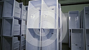 Stacks of inner cases for domestic fridges in plant storage