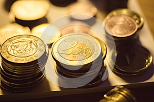 Stacks of iron euro coins on the table