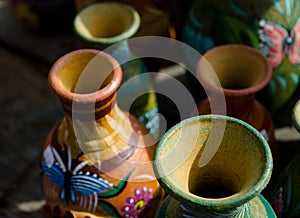 Stacks of Mexican ceramic decorative pots in workshop - 1