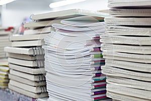 Stacks of notebooks in chancery shop closeup