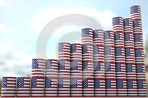 Stacks of oil drums with flag of the USA form increasing chart or upwards trend. Petroleum industry success concept, 3D