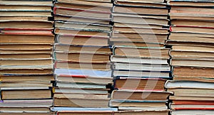 Stacks of old hardback and paperback books