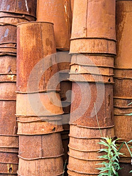 Stacks of old rusted buckets
