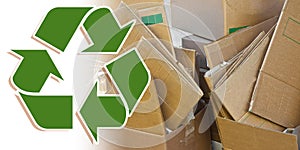 Stacks of paper and cardboard ready to be recycled - Recovery and recycling concept with recycling symbol